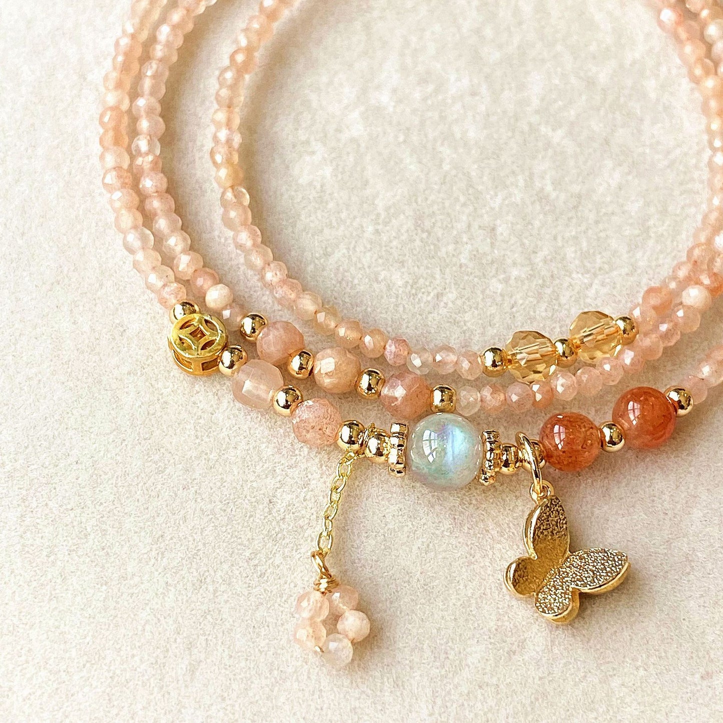Natural Crystal Orange Sunstone, Gray Moonstone, Golden Strawberry Quartz Faceted Triple-Layer Multi-Strand Bracelet butterfly fairy