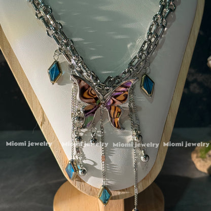 gothic whimsical siver necklace with butterfly