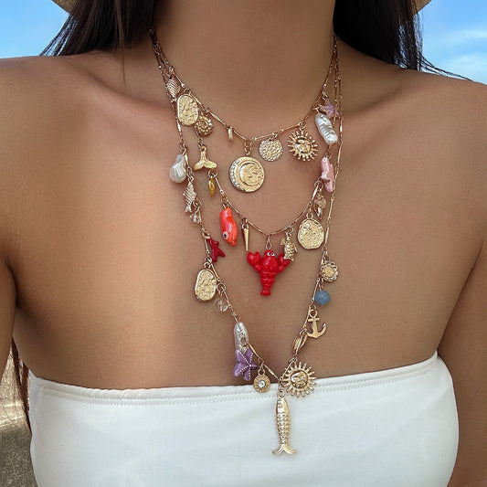 Ocean - style layered necklaces with starfish and seashells, beach vacation - themed necklaces with ins - style pendants and pearls